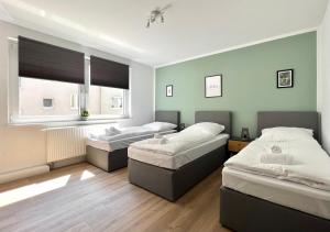 Кровать или кровати в номере Sali - R2 - Apartmenthaus, WLAN, TV