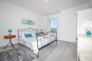 Postel nebo postele na pokoji v ubytování Villa Mediterana