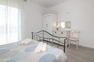 Postel nebo postele na pokoji v ubytování Villa Mediterana