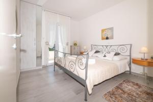 Postel nebo postele na pokoji v ubytování Villa Mediterana