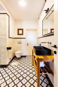 a bathroom with a sink and a toilet at jabotinsky 37 in Zikhron Ya‘aqov