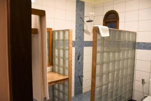 a bathroom with a shower and a glass shower backdoor at 3 Bedroom Luxury Villa-Sita in Diani in Kinondo +25 photos