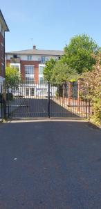 a black fence in front of a building at City Center Apartments FREE PARKING in Liverpool