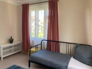 Postel nebo postele na pokoji v ubytování Apartmány Chmelničky