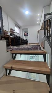 a room with two beds on display in a room at Glossy private apartment in Sarajevo