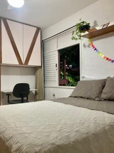 Ένα ή περισσότερα κρεβάτια σε δωμάτιο στο Suíte em Luna & Line