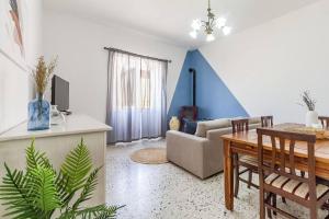 a living room with a couch and a table at Elizabeth Guest House in Arzachena