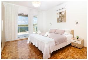 Postel nebo postele na pokoji v ubytování Apartment Legend