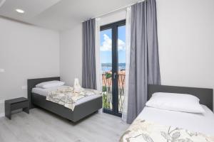 Postel nebo postele na pokoji v ubytování Sunny Day Luxury Holiday Apartments + 115 fotografií