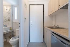 Koupelna v ubytování Astri Hotel + 37 fotografií