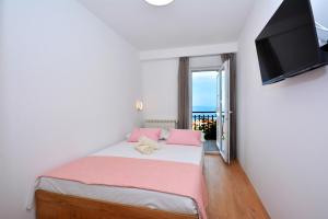 Postel nebo postele na pokoji v ubytování Apartments Radeljić