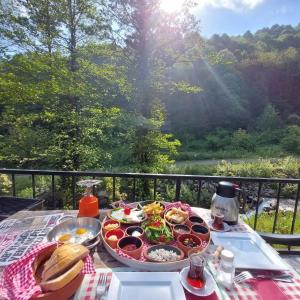a table with a tray of food on top at İstanbuldere Glamping in Sapanca