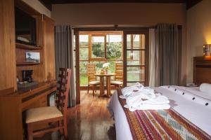 Cama ou camas em um quarto em Casa del Sol Machupicchu