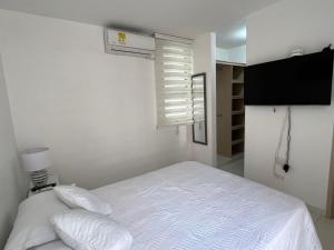 Giường trong phòng chung tại Moderno Apartamento Valle del Lili