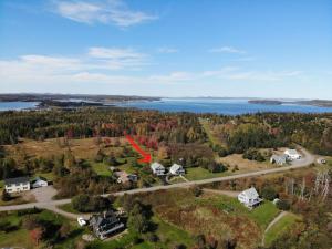 an aerial view of a house with a red arrow on it at Spindrift in Eastport +15 photos