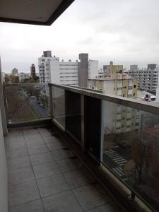 a balcony with a view of a city with buildings at Departamento 2 ambientes in La Plata