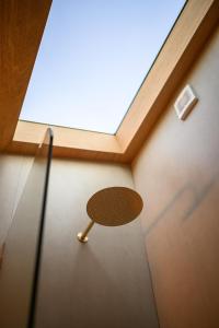 a chair in a room with a window at Sellicks Hill Eco Cabin - C21 SouthCoast Holidays in Sellicks Hill