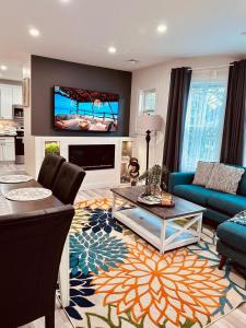 a living room with a couch and a table at Private Luxury Framingham condo near Boston in Framingham