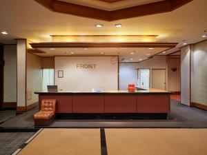 a view of a front desk in a lobby at Tabist Izu Atagawa Onsen Hotel Gyokuryu in Higashiizu