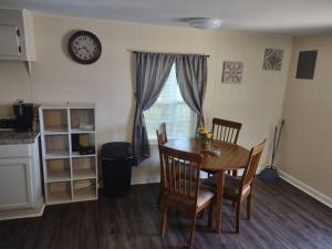 a dining room with a table and chairs and a window at Everything you need in Leesville