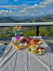 a tray of food sitting on a table on a balcony at Phu Phop Kham in Ban Huai Khai