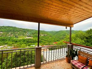 a balcony with a view of the mountains at Hotel VIM in Sighnaghi in Sighnaghi