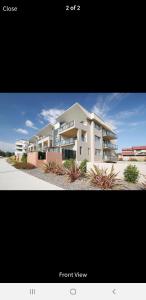 a picture of a large apartment building at GREENWAY WATERS Apartments in Tuggeranong