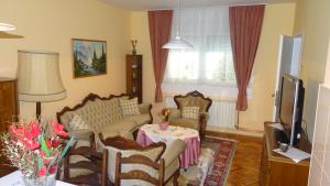 a living room with a couch and a table at Nikiva I in Ćuprija