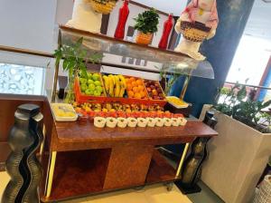 a display of fruits and vegetables on a table at Golden Tulip Al Khobar in Al Khobar