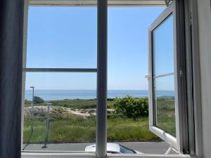 a view of the ocean from a window at Sea views in Southwell