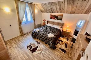 a bedroom with a large bed in a room at Cristina House in Braşov