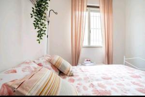 A bed or beds in a room at Casa Gioia