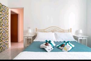 A bed or beds in a room at Casa Gioia