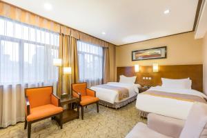 Voodi või voodid majutusasutuse Beijing Jinlong Hotspring Hotel toas