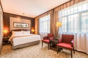 Voodi või voodid majutusasutuse Beijing Jinlong Hotspring Hotel toas