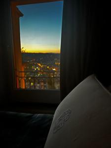 a room with a window with a view of a city at B&B La Cuntana in Potenza