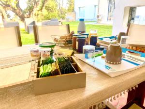 a table with a box of vegetables on it at Chambres d’hôtes A Casa Di Marigaby in Barbaggio