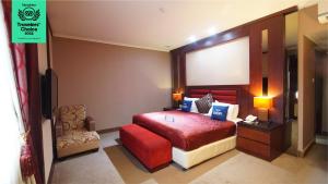 Krevet ili kreveti u jedinici u objektu Dafam Hotel Cilacap