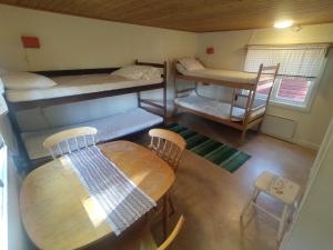 Postel nebo postele na pokoji v ubytování Selholmens Camping