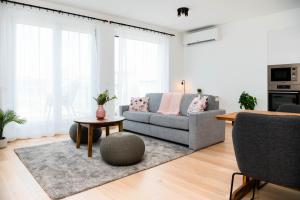 a living room with a couch and a table at Elisabeth Downtown Apartments by UrbanRent in Budapest