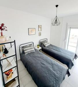 Postel nebo postele na pokoji v ubytování Perla Sea View Apartments