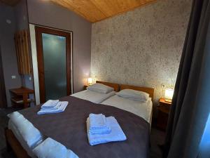 מיטה או מיטות בחדר ב-Hotel VIM in Sighnaghi