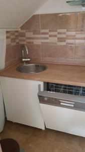 a kitchen with a sink and a counter top at Apartments Katarina in Sutivan