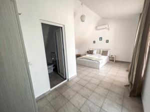a bedroom with a bed and a mirror at Vila Ithea in 2 Mai +19 photos