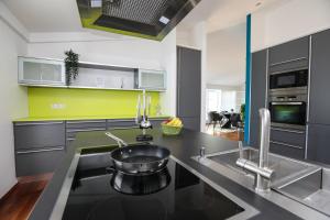 a kitchen with a sink and a counter top at ~ Regensburg schönstes Appartment~ in Sinzing