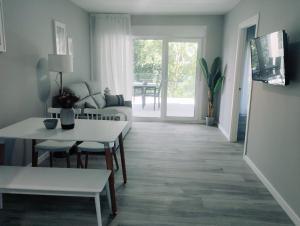 a living room with a couch and a table at Finca El Rabil in Cangas de Onís