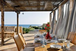 a dining table with a view of the ocean at Villa Vito in Hvar