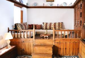 a living room with a couch and a table at Casa Lindos in Lindos