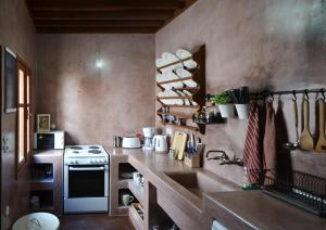 a small kitchen with a sink and a stove at Casa Lindos in Lindos