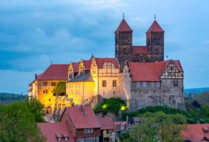a large castle sitting on top of a city at Redlinburg II in Quedlinburg +13 photos